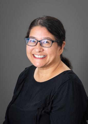 Head Shot of Brenda O'Brien who is wearing a black top in glasses